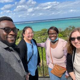 Fellows posing by beach